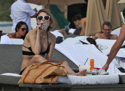 http://img291.imagevenue.com/loc67/th_311781414_Mischa_Barton_Bikini_Candids_on_the_Beach_in_Miami_December_27_2011_096_122_67lo.jpg